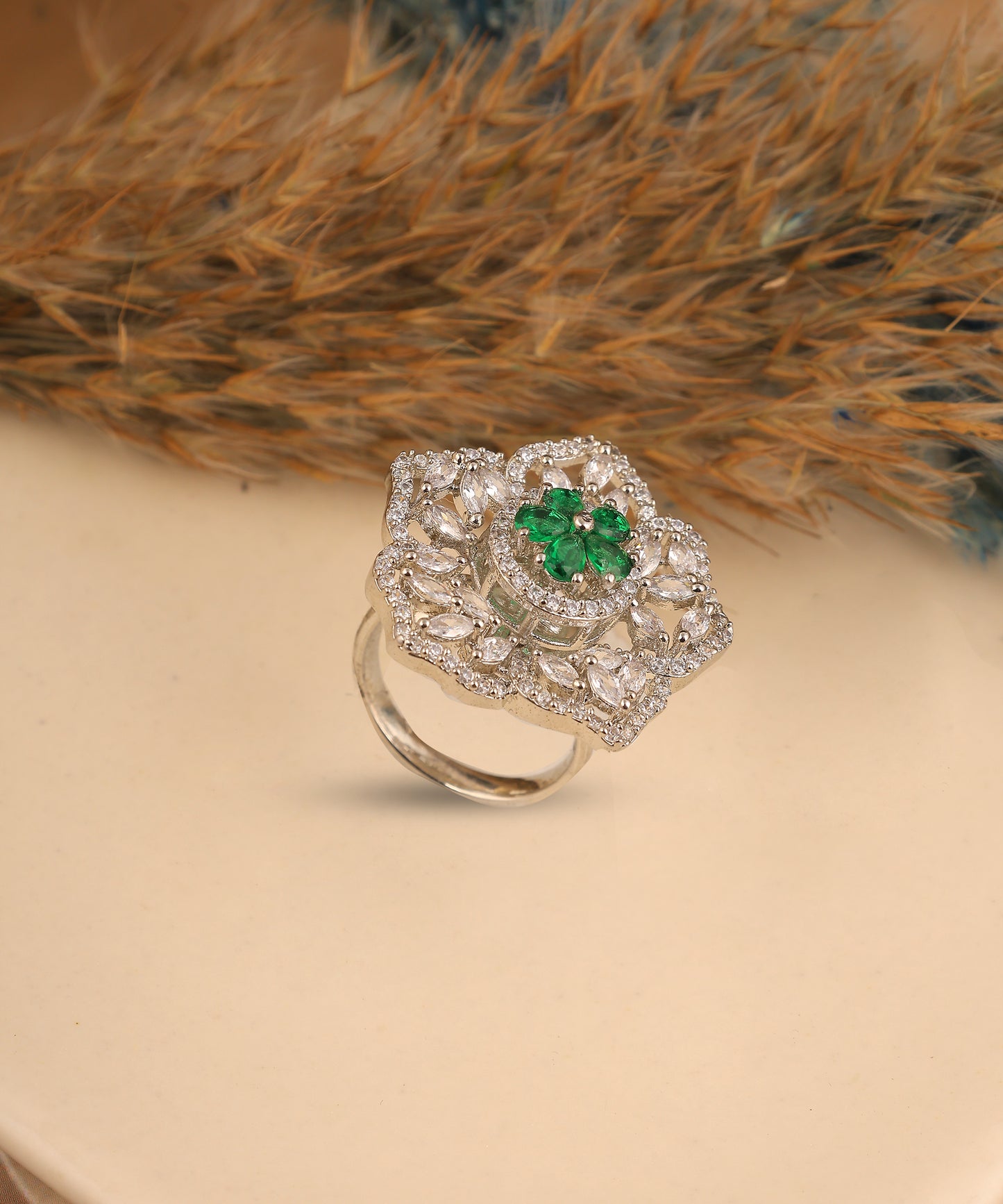 Flower Shaped Crystal And Emerald Stone Studded Artificial Diamond Ring