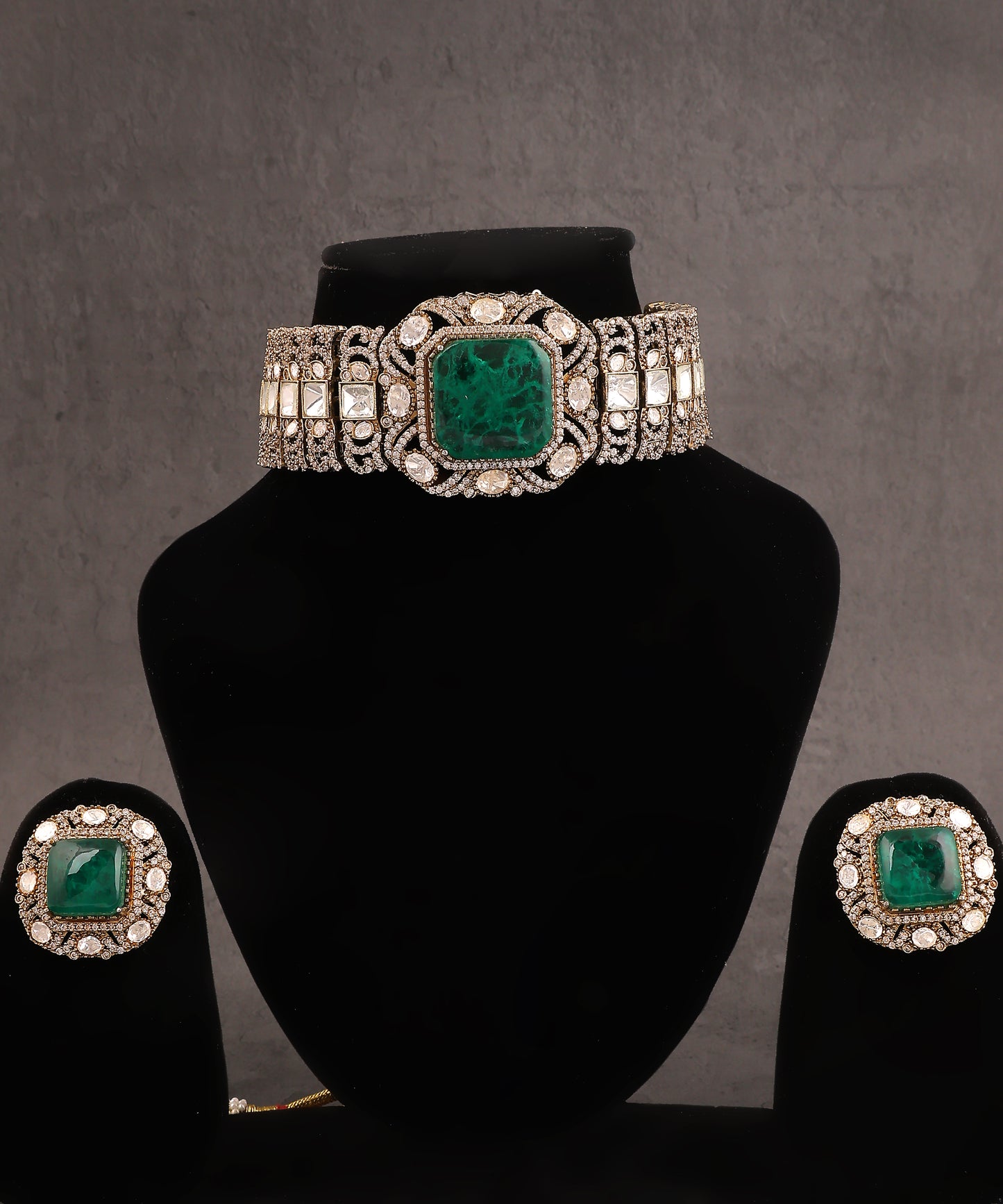 Adhrika Choker Featuring Equisite Polkis And emerald Doublet Stone