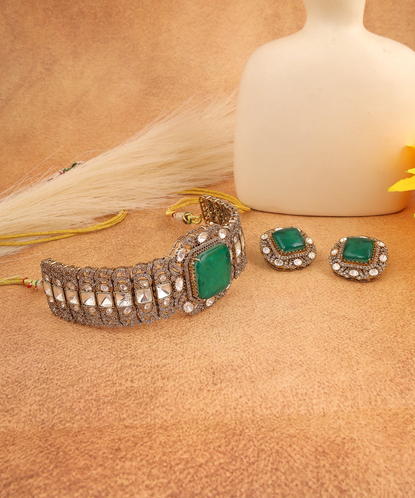 Adhrika Choker Featuring Equisite Polkis And emerald Doublet Stone